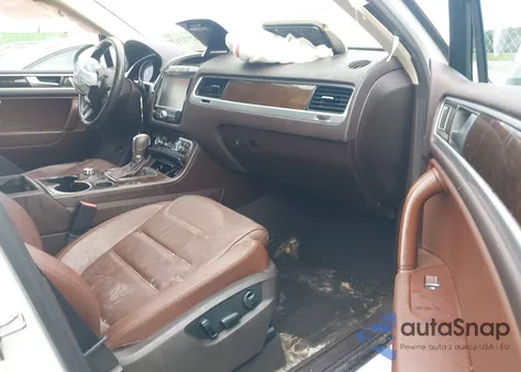 2014 Volkswagen Touareg 3.6L Executive z USA, uszkodzony, nr VIN WVGEF9BP0ED008047